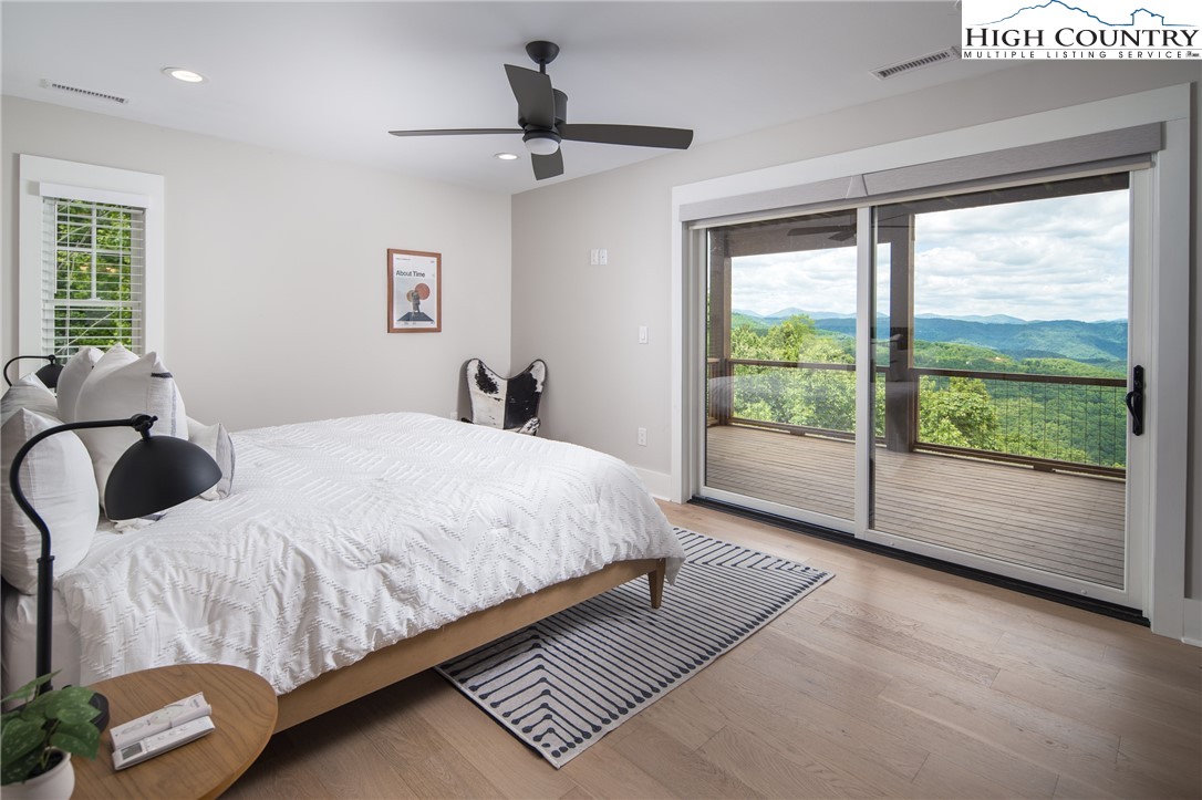 192 North Face Trail Boone, NC 28607 - Photo 25 of 38 a bedroom with a large bed and a large window