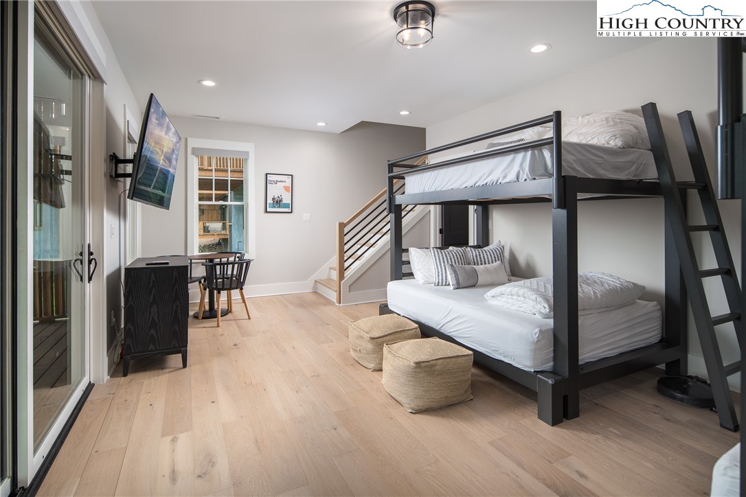 192 North Face Trail Boone, NC 28607 - Photo 30 of 38 a bedroom with furniture and a wooden floor