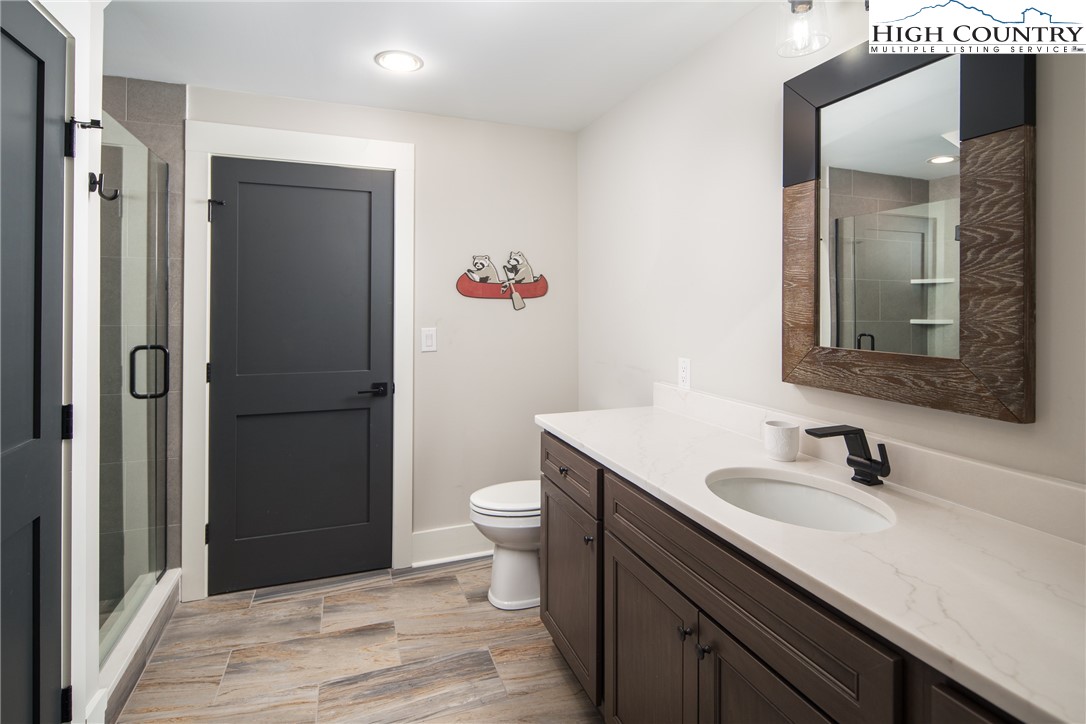 192 North Face Trail Boone, NC 28607 - Photo 31 of 38 a bathroom with a sink and a mirror