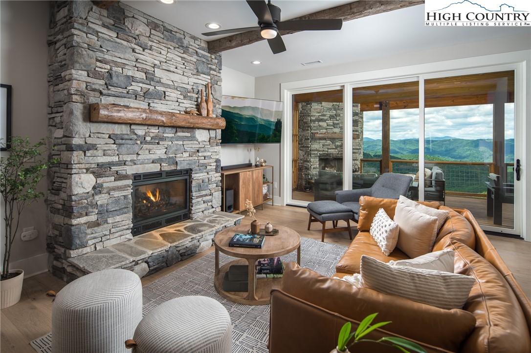 192 North Face Trail Boone, NC 28607 - Photo 4 of 38 a living room with furniture fireplace and a large window