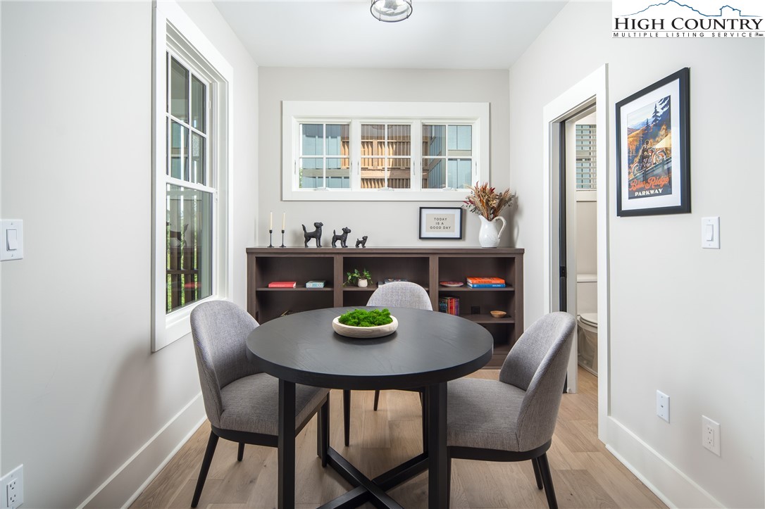 192 North Face Trail Boone, NC 28607 - Photo 10 of 38 a view of a dining room with furniture window and wooden floor