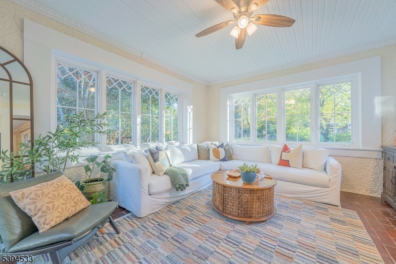 16 W Road Short Hills, NJ 07078 - Photo 11 of 47 a living room with furniture and a potted plant