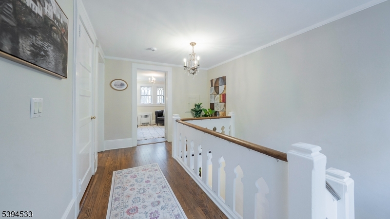 16 W Road Short Hills, NJ 07078 - Photo 22 of 47 a view of hallway with wooden floor