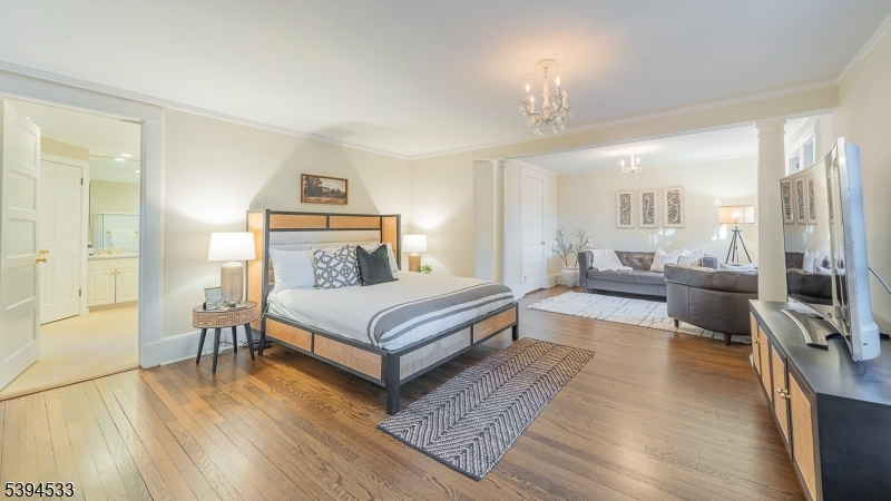 16 W Road Short Hills, NJ 07078 - Photo 24 of 47 a bedroom with a bed a large window and couch