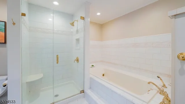 a bathroom with a bathtub and shower