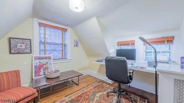 a work room with furniture and a window