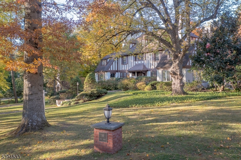 16 W Road Short Hills, NJ 07078 - Photo 3 of 47 a front view of a house with a yard