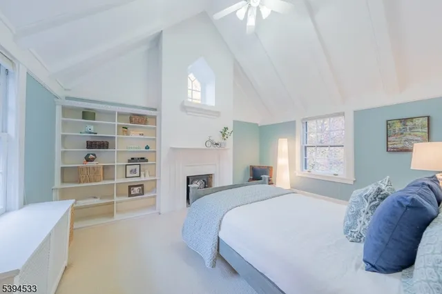 a spacious bedroom with a bed and a cabinets