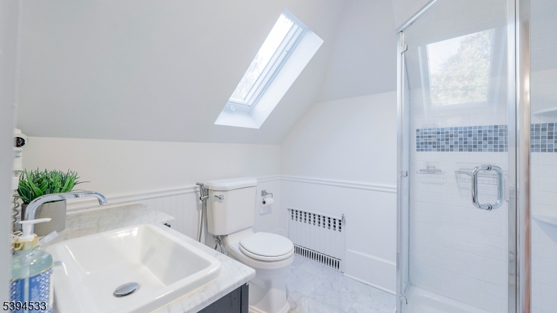 16 W Road Short Hills, NJ 07078 - Photo 37 of 47 a bathroom with a sink a toilet and tub