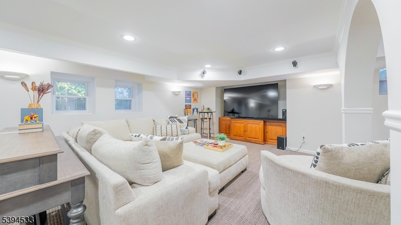 16 W Road Short Hills, NJ 07078 - Photo 39 of 47 a living room with furniture and a flat screen tv