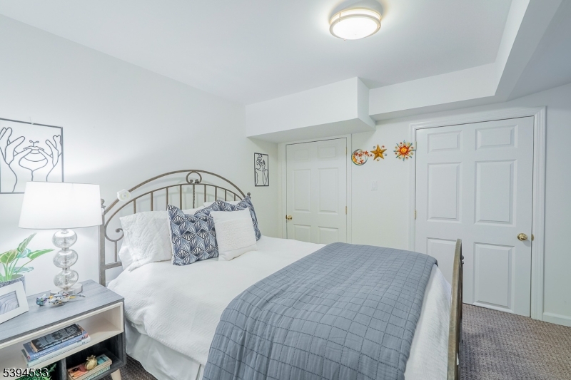 16 W Road Short Hills, NJ 07078 - Photo 40 of 47 a bedroom with a bed and a window