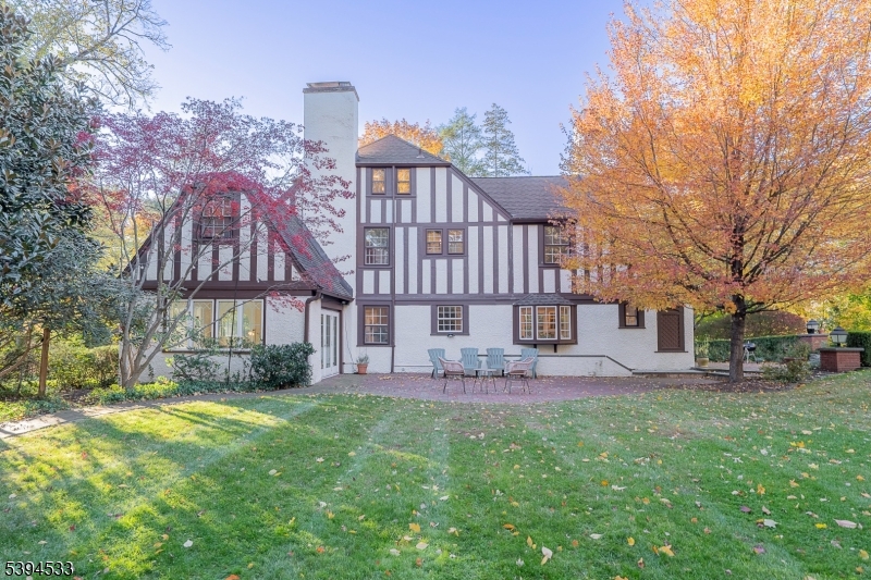 16 W Road Short Hills, NJ 07078 - Photo 45 of 47 a view of a big house with a big yard and large trees