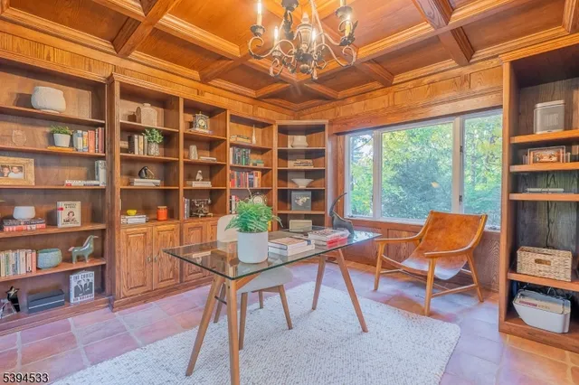a work room with furniture and a bookshelf