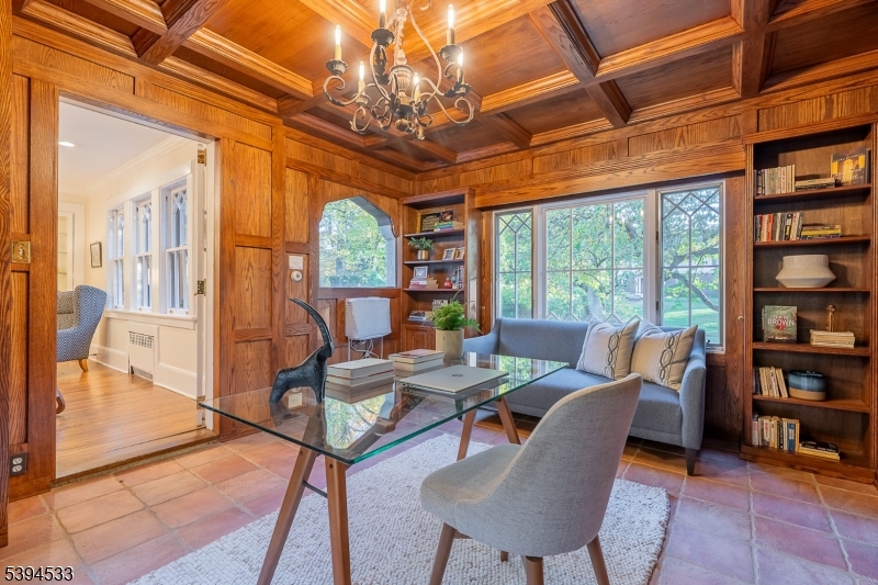 16 W Road Short Hills, NJ 07078 - Photo 10 of 47 a living room with furniture a bookshelf and a large window