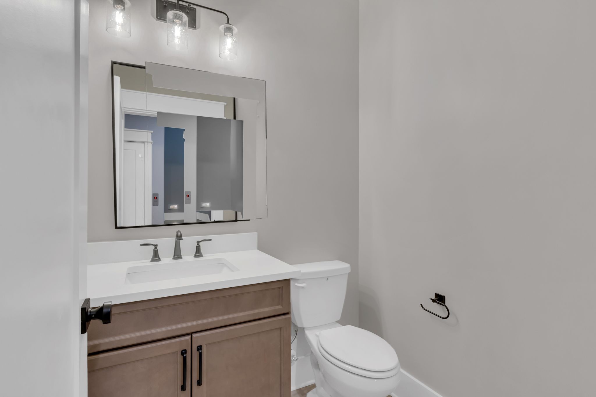 1445 Doc Johns Boulevard Murfreesboro, TN 37128 - Photo 11 of 54 a bathroom with a toilet sink and mirror