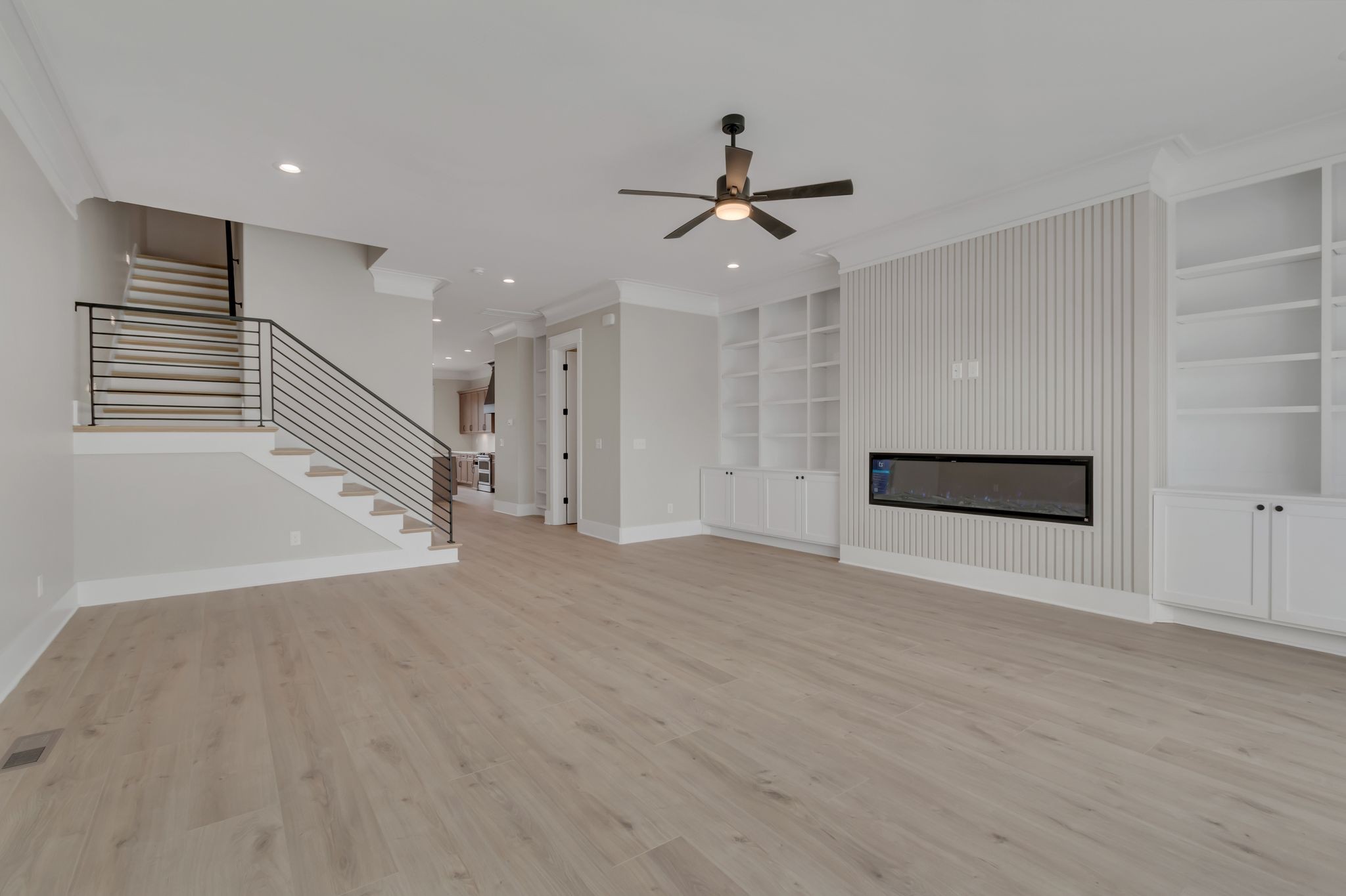1445 Doc Johns Boulevard Murfreesboro, TN 37128 - Photo 23 of 54 a view of an empty room with wooden floor and a ceiling fan