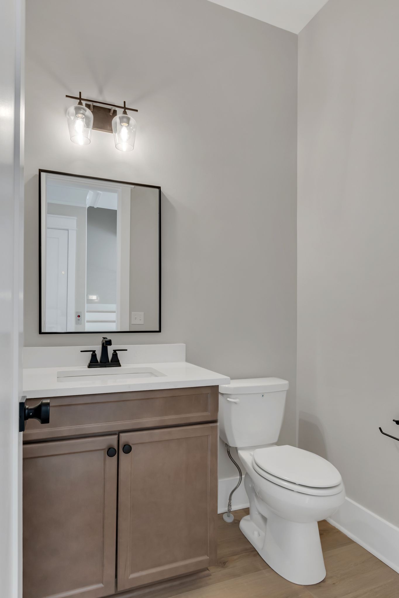 1445 Doc Johns Boulevard Murfreesboro, TN 37128 - Photo 24 of 54 a bathroom with a toilet sink and mirror