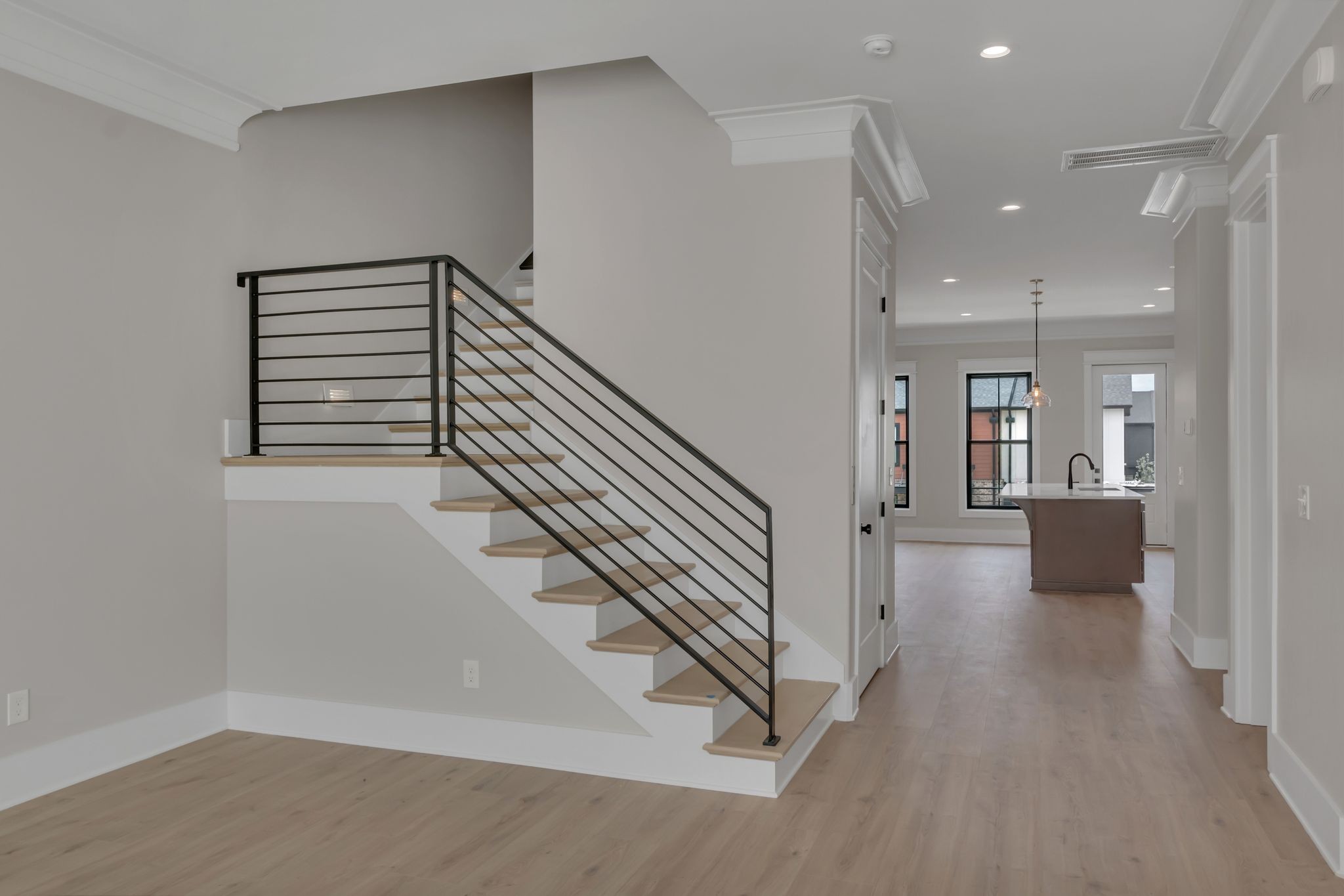 1445 Doc Johns Boulevard Murfreesboro, TN 37128 - Photo 27 of 54 a view of a hallway with wooden floor and staircase