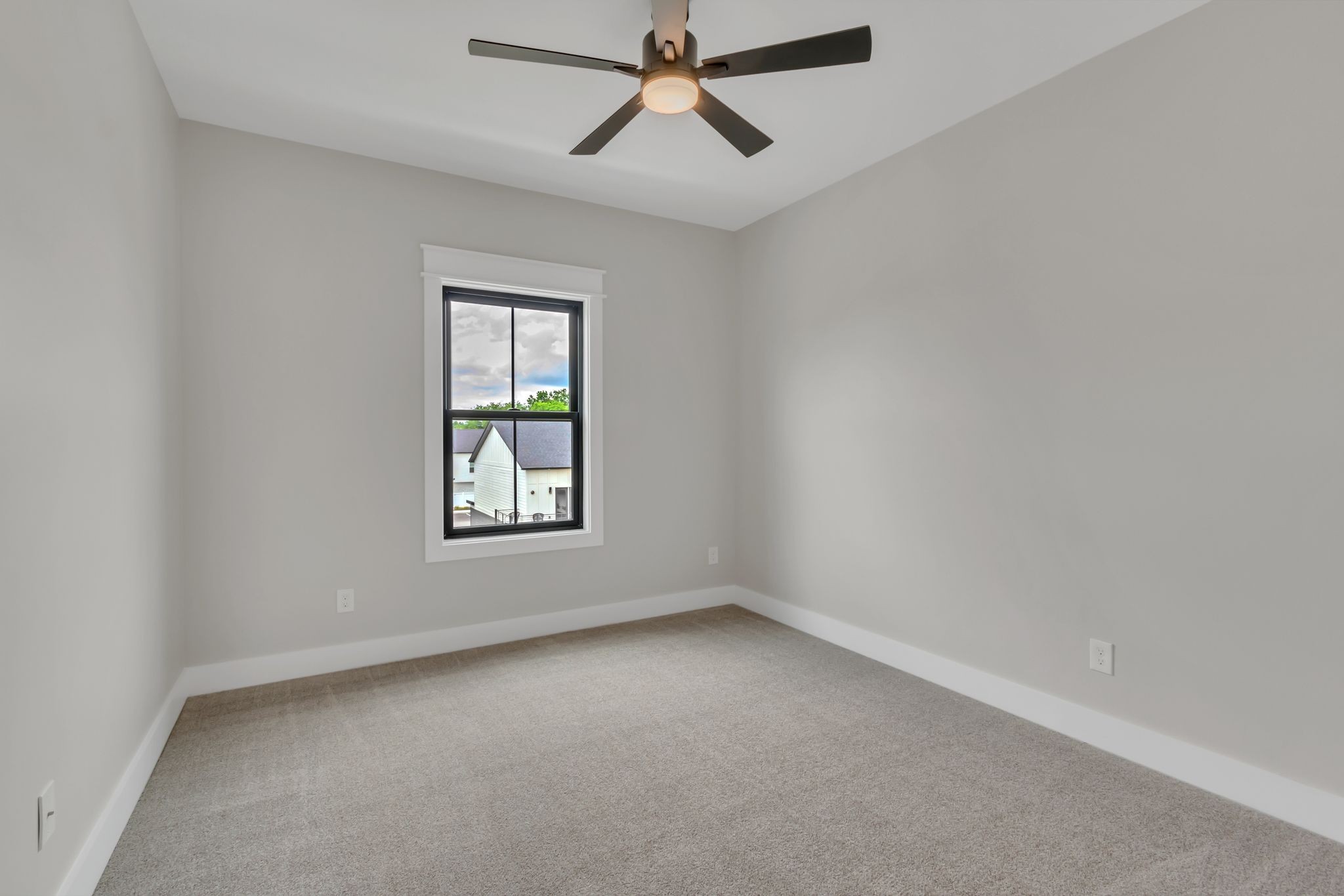 1445 Doc Johns Boulevard Murfreesboro, TN 37128 - Photo 32 of 54 an empty room with a window and a fan