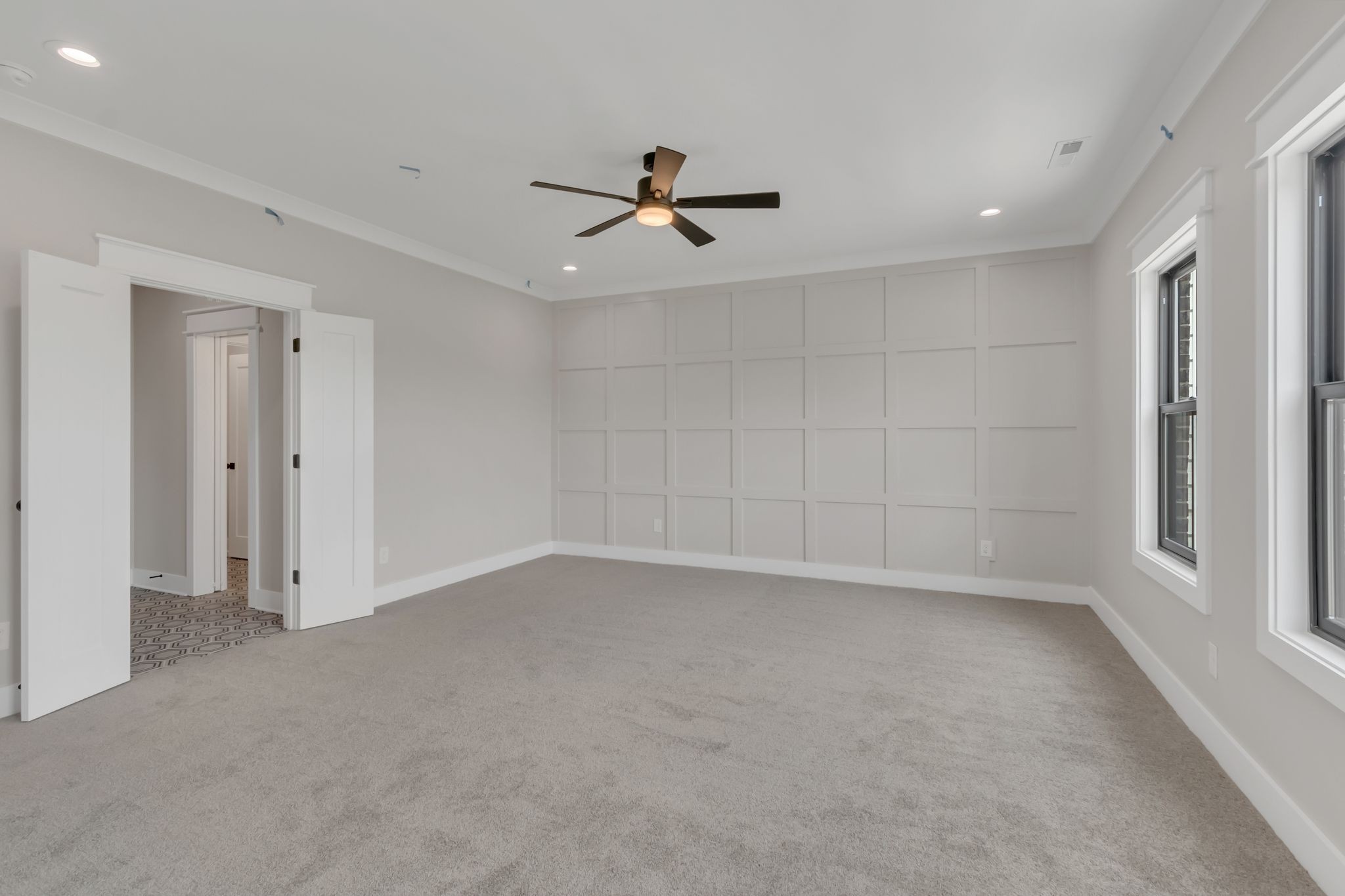 1445 Doc Johns Boulevard Murfreesboro, TN 37128 - Photo 40 of 54 an empty room with chandelier fan and windows