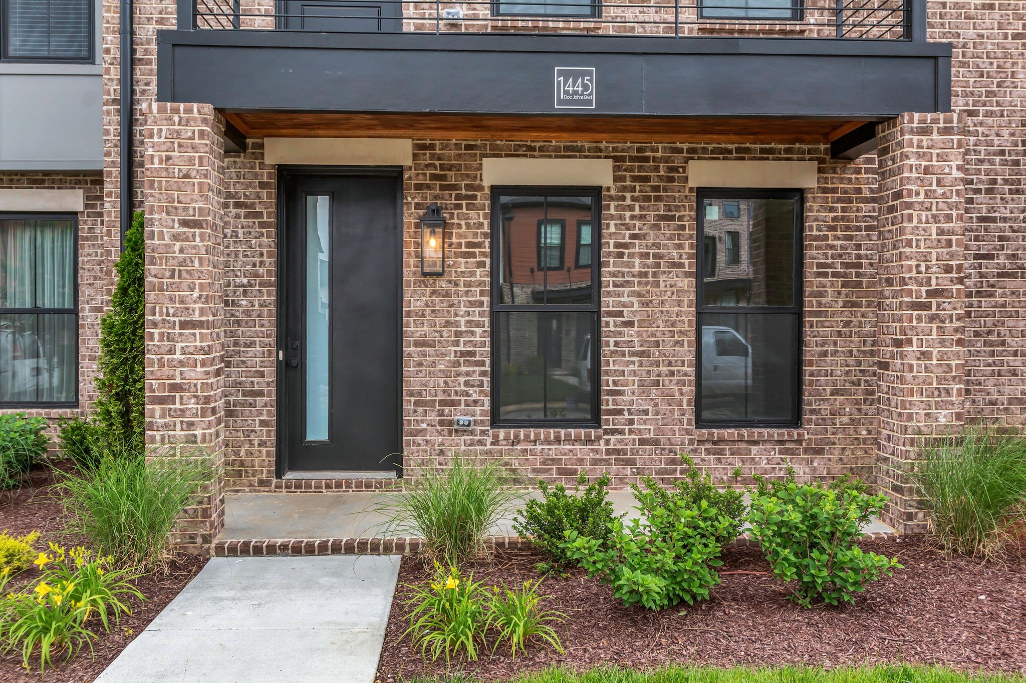1445 Doc Johns Boulevard Murfreesboro, TN 37128 - Photo 5 of 54 a front view of a house with potted plants