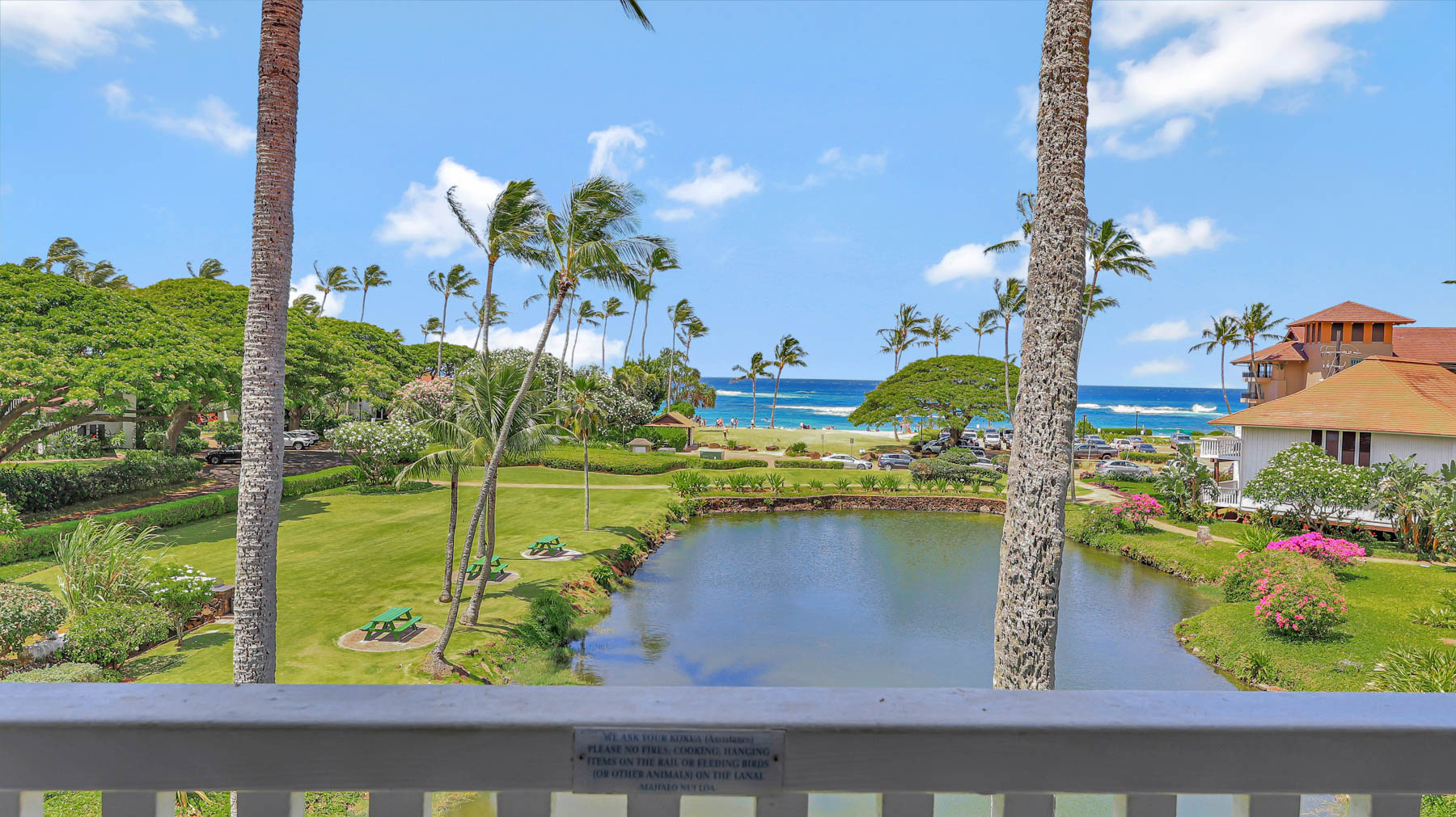2253 Poipu Road, Unit 218 Koloa, HI 96756 - Photo 1 of 23 a view of a swimming pool with a yard and sitting area