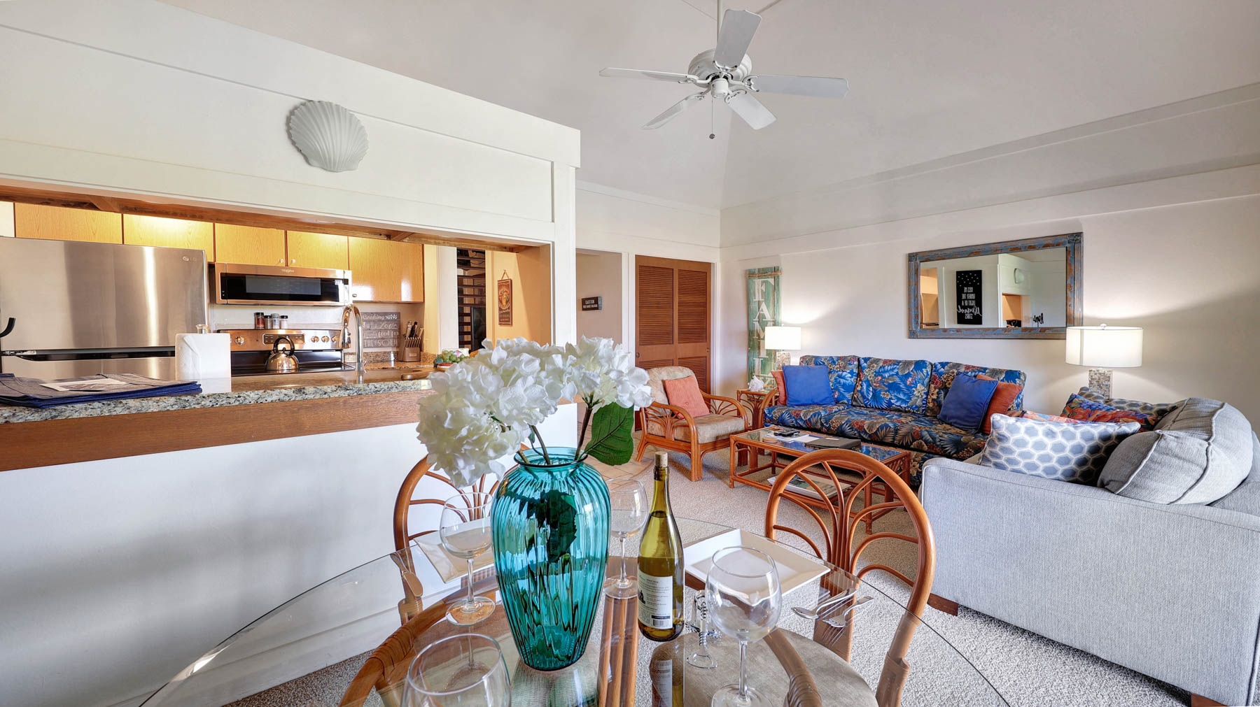 2253 Poipu Road, Unit 218 Koloa, HI 96756 - Photo 15 of 23 a living room with furniture potted plant and a large window