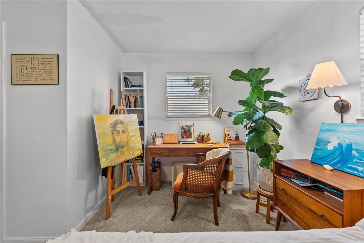 10803 Oberrender Road Needville, TX 77461 - Photo 18 of 36 a view of a workspace with furniture and a potted plant