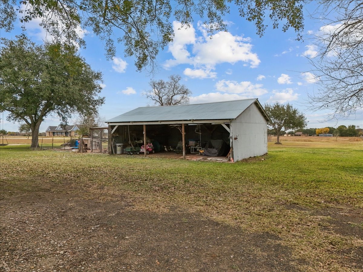 10803 Oberrender Road Needville, TX 77461 - Photo 32 of 36 a front view of a house with garden