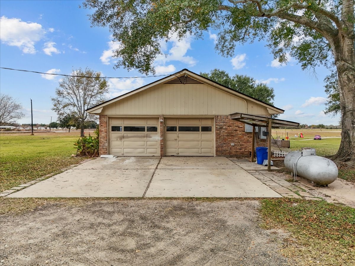 10803 Oberrender Road Needville, TX 77461 - Photo 35 of 36 a view of a house with a entertaining space