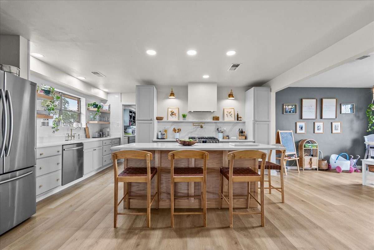 10803 Oberrender Road Needville, TX 77461 - Photo 4 of 36 a large kitchen with a table and chairs