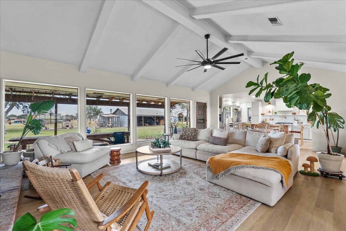 10803 Oberrender Road Needville, TX 77461 - Photo 6 of 36 a living room with furniture ceiling fan and a large window