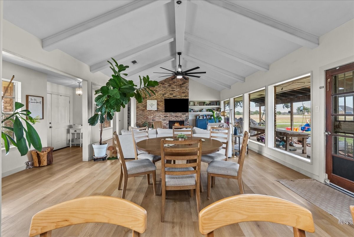 10803 Oberrender Road Needville, TX 77461 - Photo 8 of 36 a view of a dining room with furniture window and wooden floor