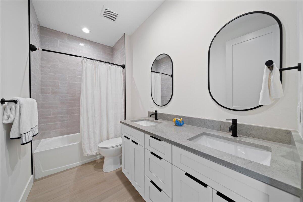 223 6th Avenue Indialantic, FL 32903 - Photo 12 of 26 a bathroom with a sink and a mirror