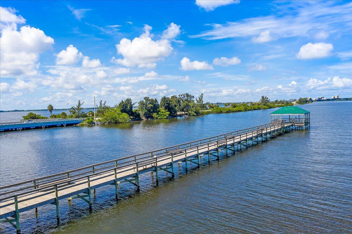 223 6th Avenue Indialantic, FL 32903 - Photo 25 of 26 a view of a lake with a table and chairs