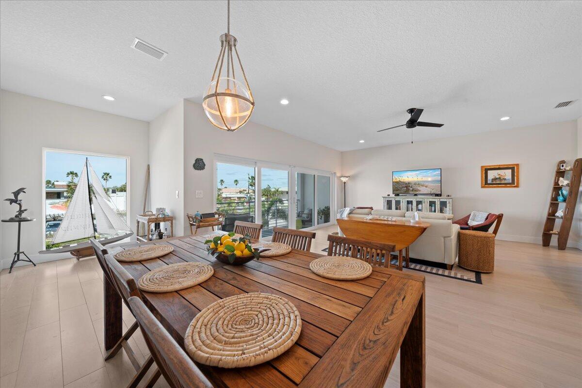 223 6th Avenue Indialantic, FL 32903 - Photo 3 of 26 a living room with furniture kitchen view and a chandelier
