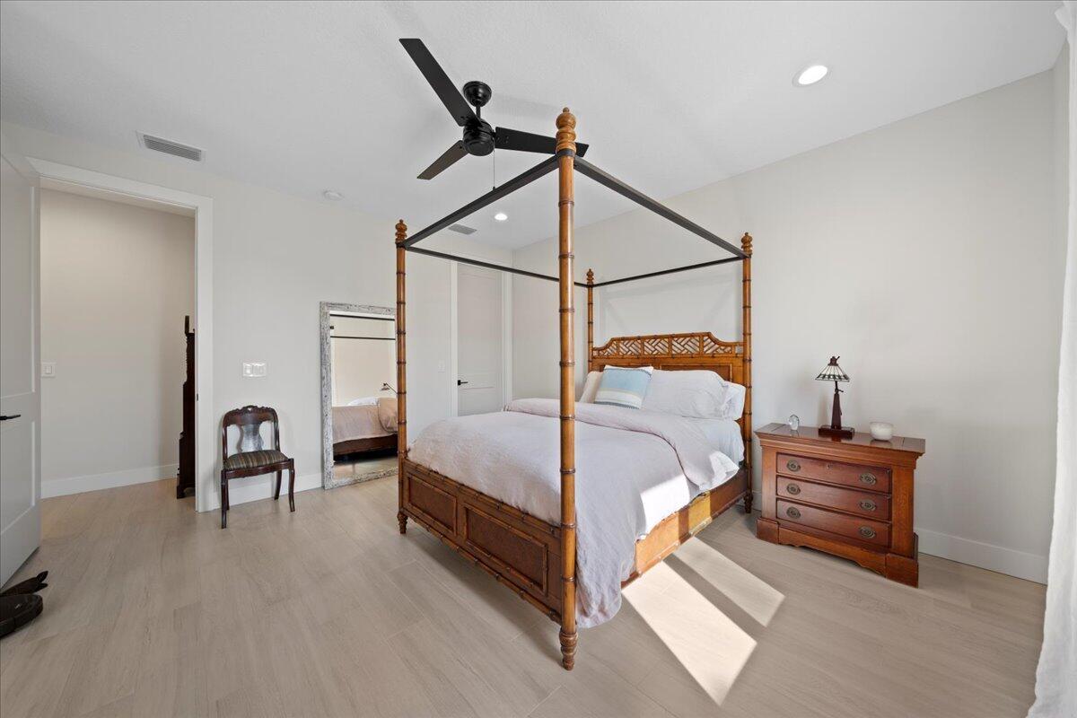 223 6th Avenue Indialantic, FL 32903 - Photo 8 of 26 a bed room with a bed and a chair