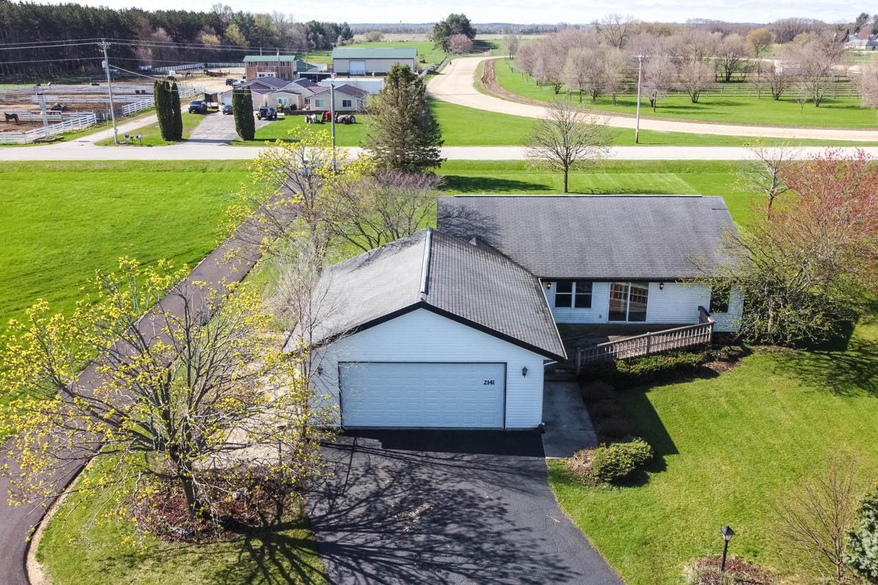 2141 Fischer Road South Beloit, IL 61080 - Photo 2 of 25 an aerial view of a house with garden space and street view