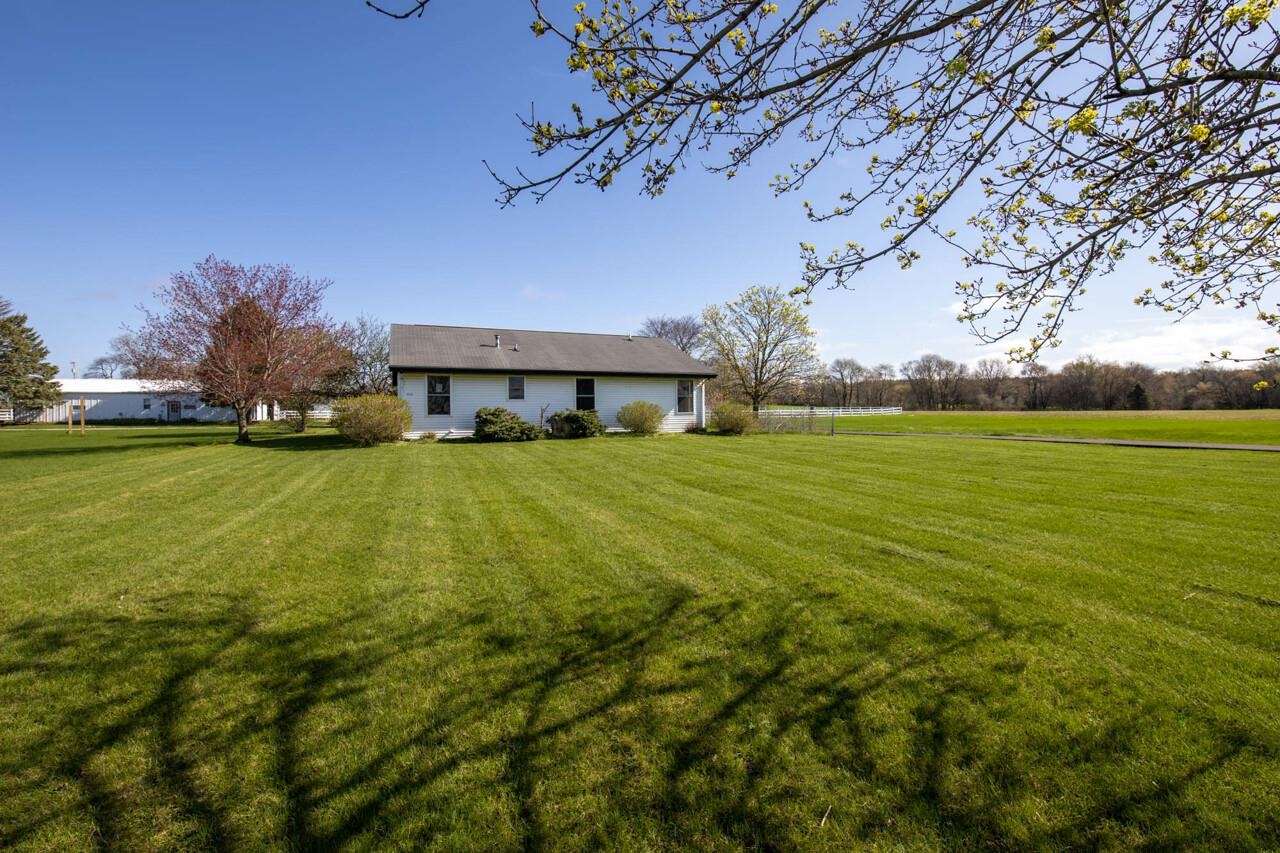 2141 Fischer Road South Beloit, IL 61080 - Photo 4 of 25 a view of a large building with a big yard