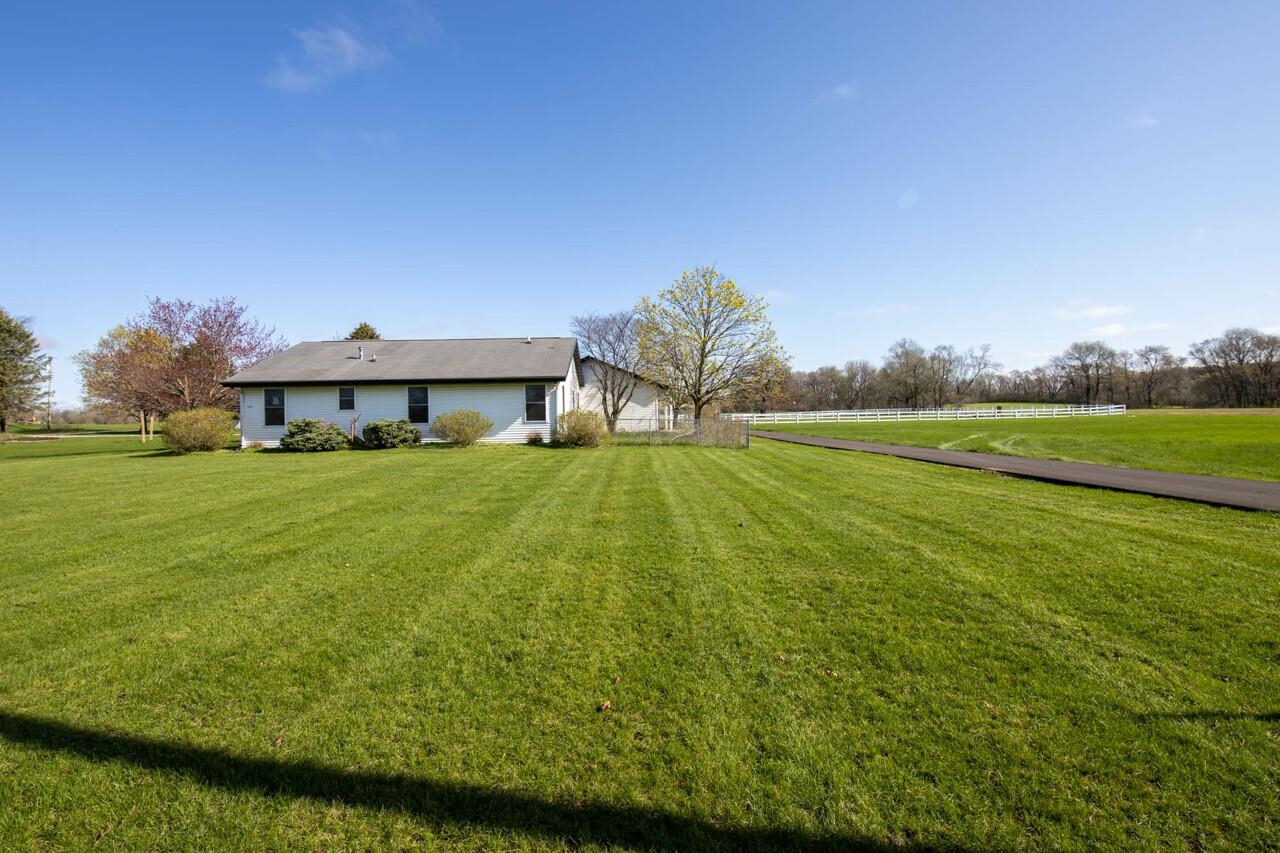 2141 Fischer Road South Beloit, IL 61080 - Photo 5 of 25 a house view with a garden space