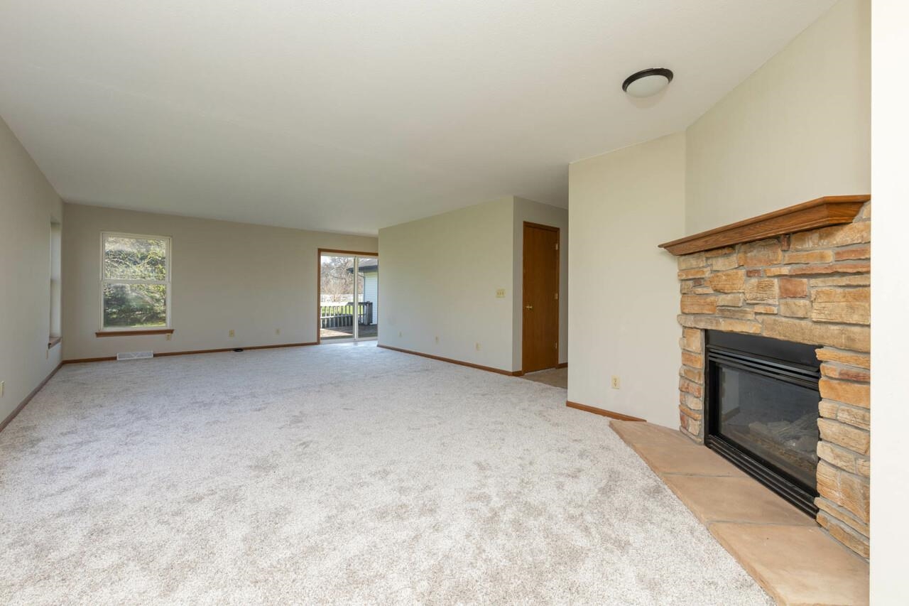 2141 Fischer Road South Beloit, IL 61080 - Photo 8 of 25 a view of an empty room with fire place and a fireplace