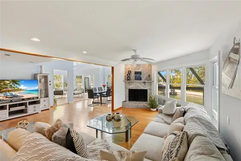 a kitchen with stainless steel appliances granite countertop a sink a stove and cabinets