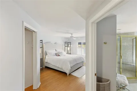 a bedroom with a large bed and a large window