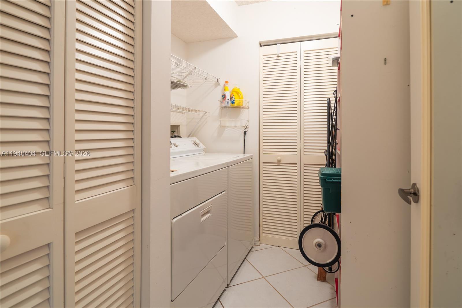 2541 North Nob Hill Road, Unit 309 Sunrise, FL 33322 - Photo 12 of 31 a bathroom with a sink and a window