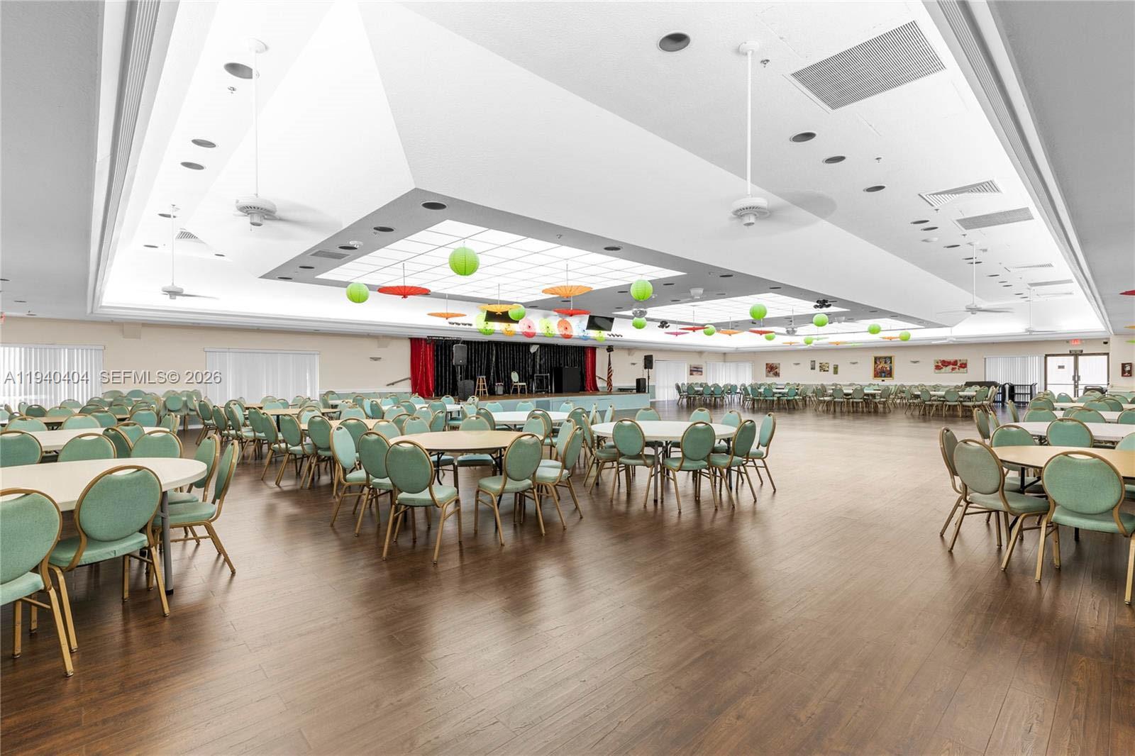2541 North Nob Hill Road, Unit 309 Sunrise, FL 33322 - Photo 14 of 31 a dining room with lots of furniture and wooden floor