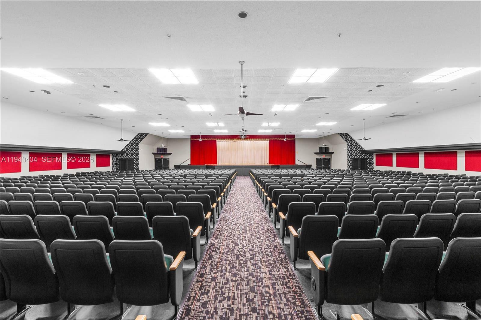 2541 North Nob Hill Road, Unit 309 Sunrise, FL 33322 - Photo 15 of 31 a living room with lots of chairs and a rug