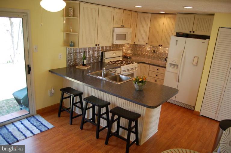 VIEW IN THE KITCHEN FROM THE GARAGE ENTRANCE