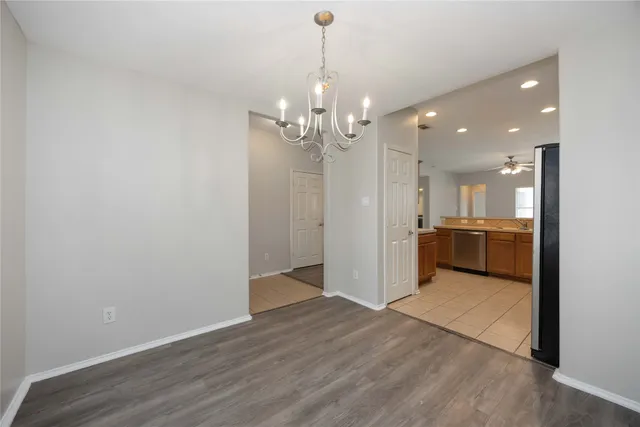 a view of a kitchen with a sink and dishwasher in kitchen
