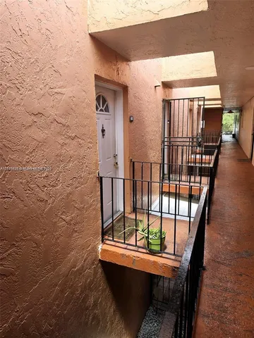 a view of balcony with furniture