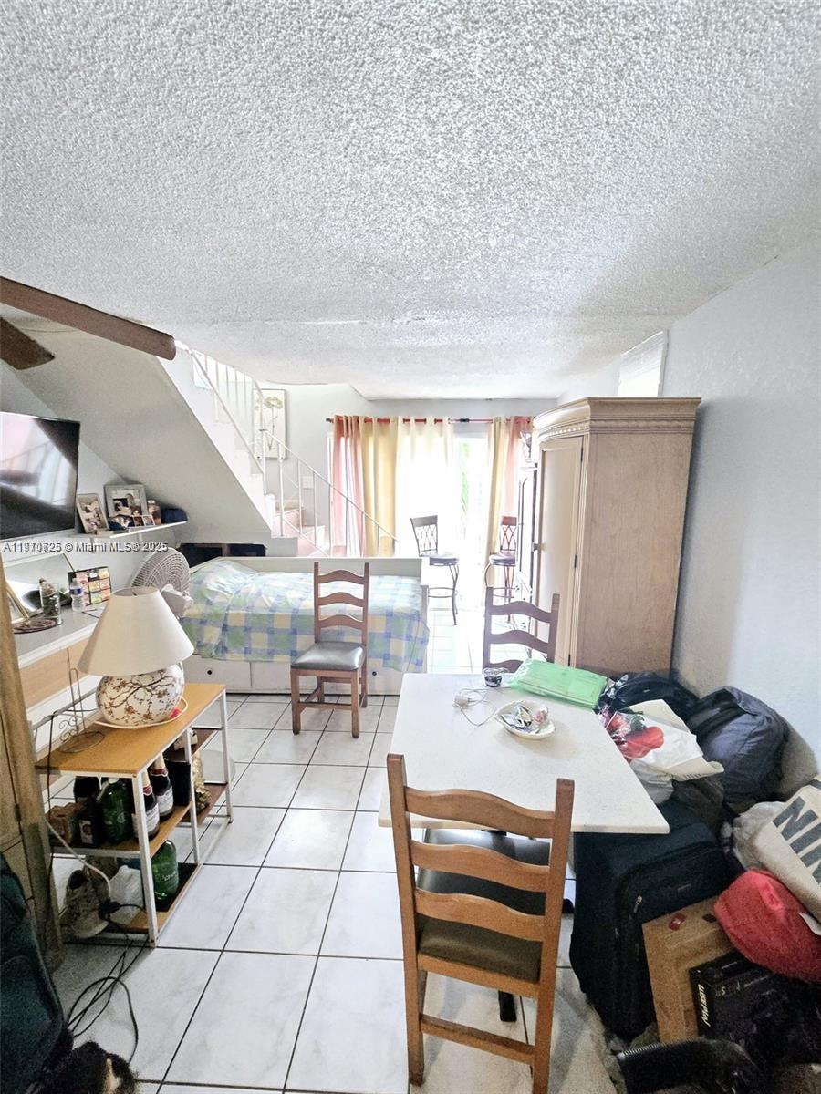 1300 West 47th Place, Unit 217B Hialeah, FL 33012 - Photo 4 of 4 a view of a dining room with furniture window and outside view